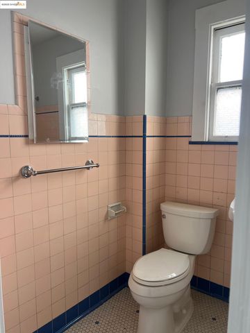 a white toilet sitting next to a bathroom sink