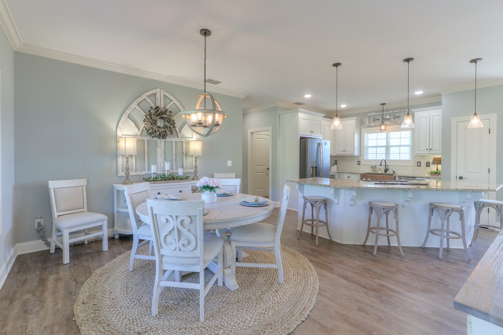 1264 Norton Road Manchester, TN 37355 - Photo 22 of 39 a view of a dining room with furniture a chandelier and wooden floor