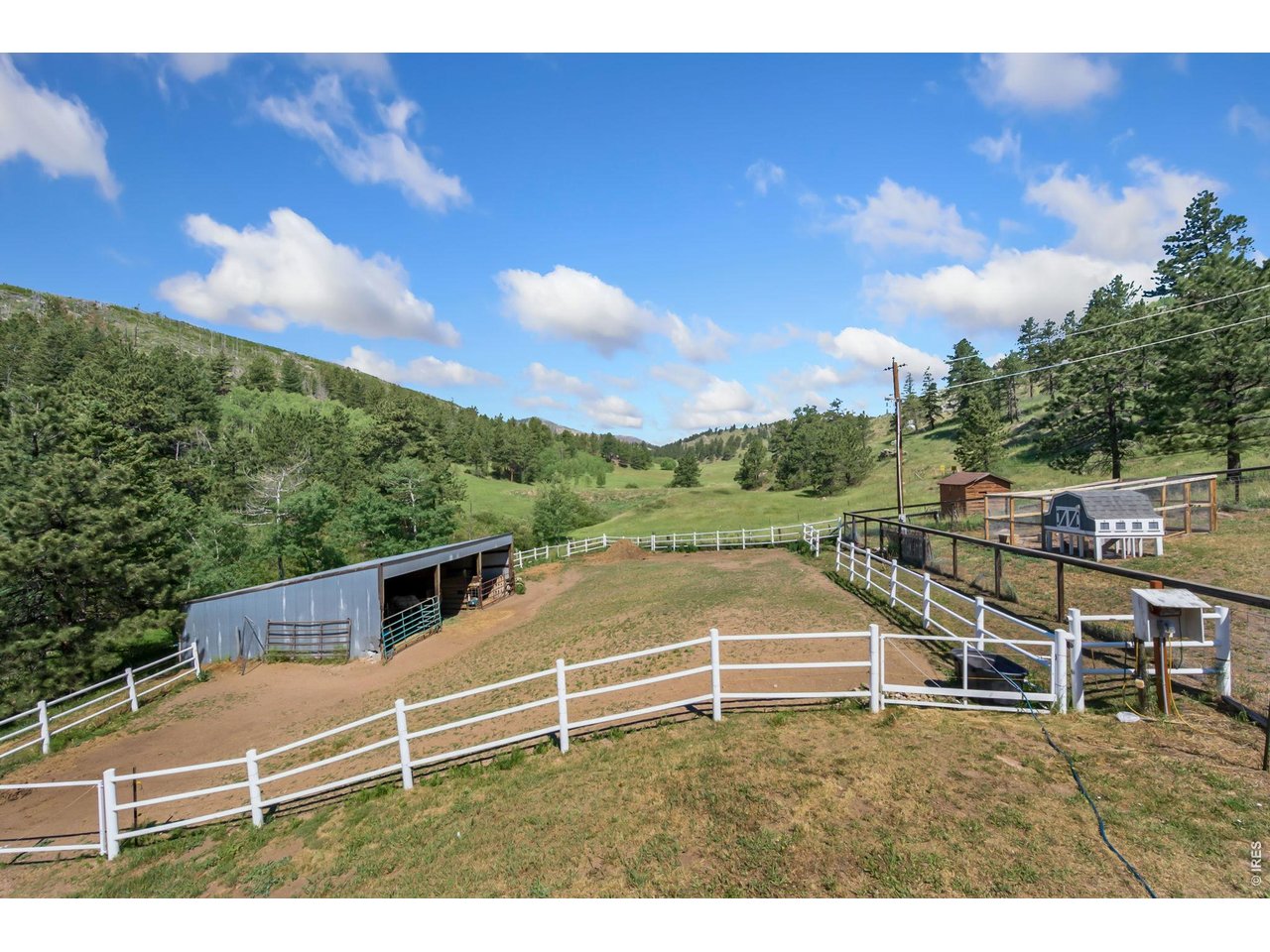 1154 Spring Valley Road Bellvue, CO 80512 - Photo 26 of 31 Large loafing shed with iron fence, reinforced with electric fence.