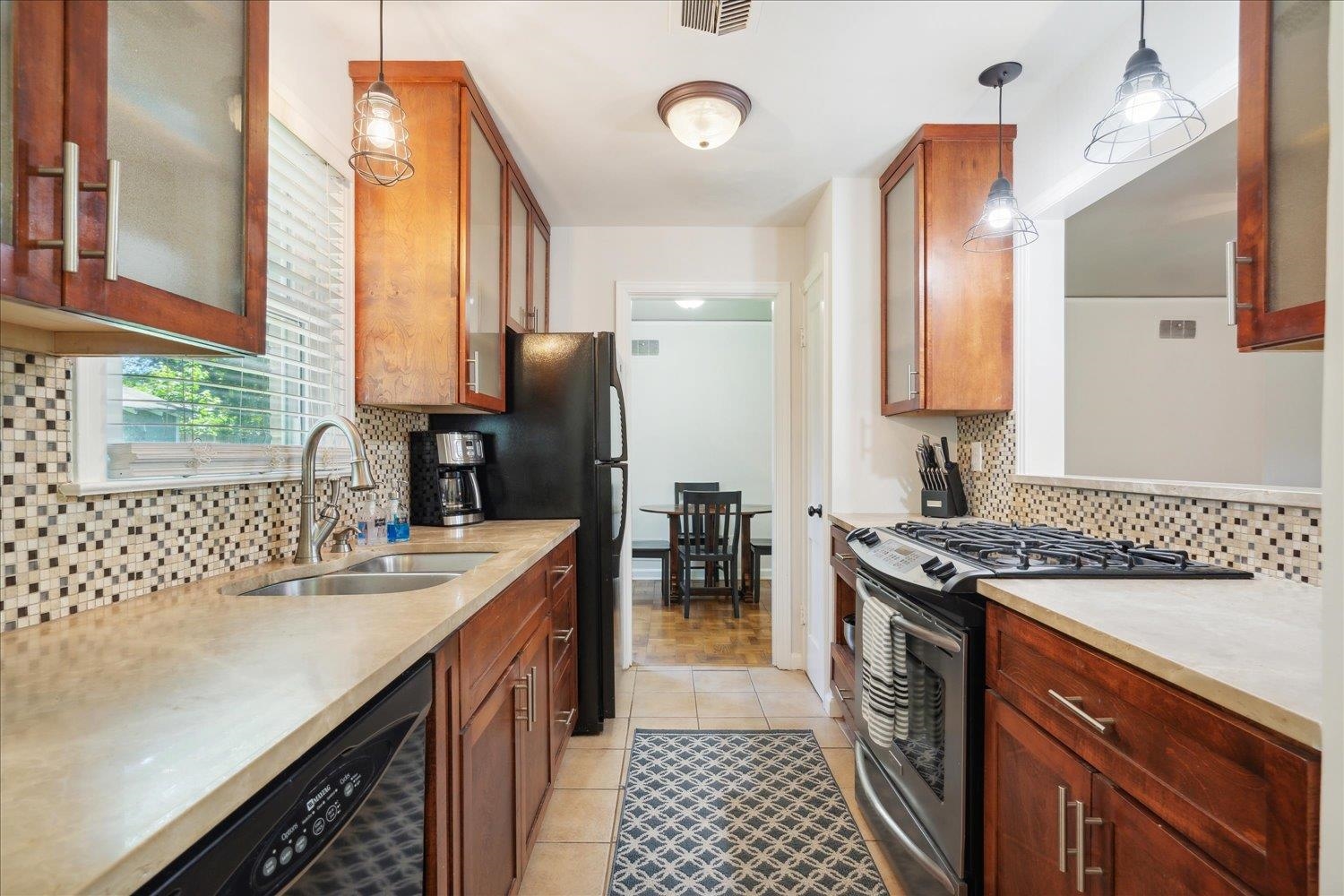 5013 New Castle Road Memphis, TN 38117 - Photo 16 of 28 a kitchen with a sink stove and refrigerator
