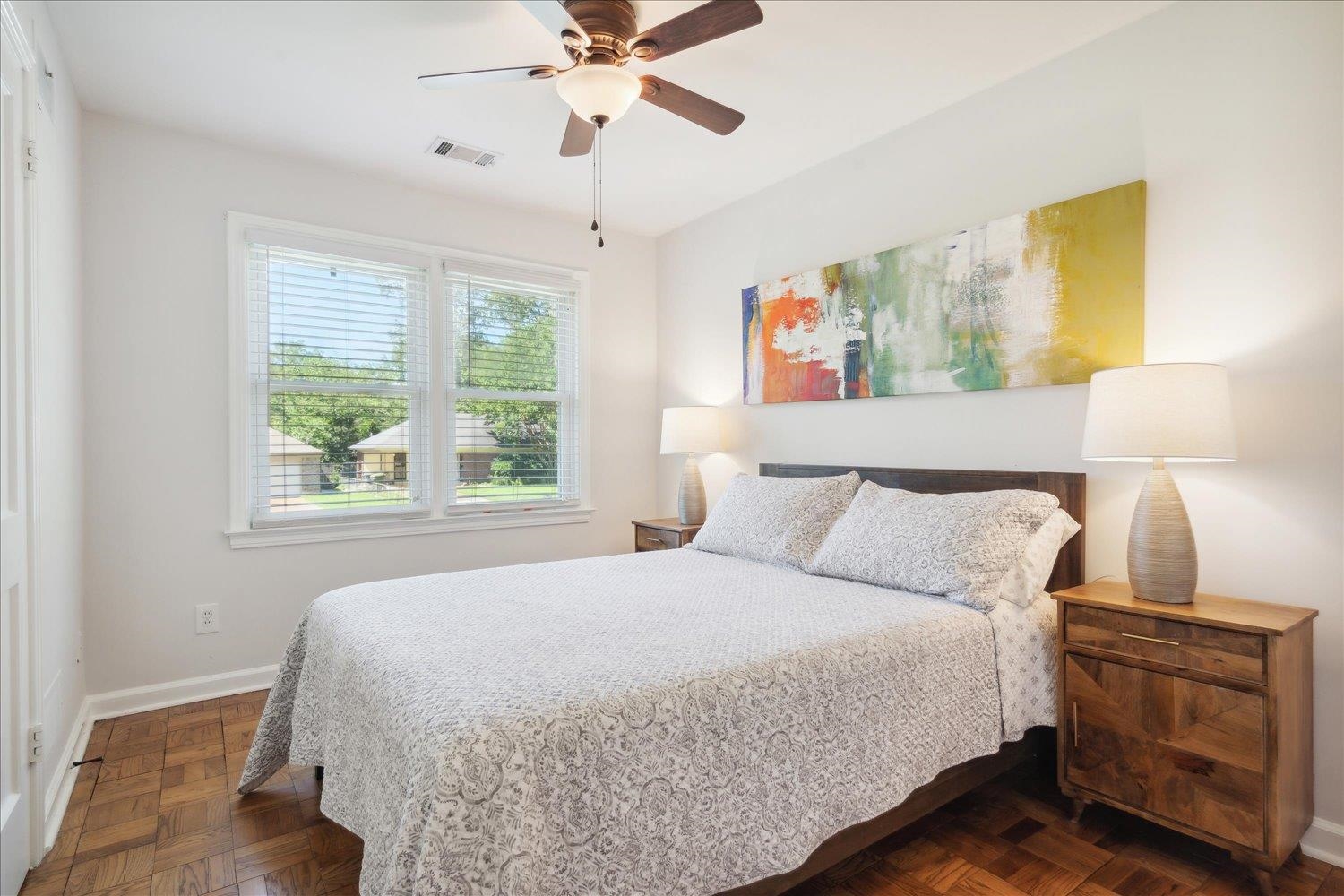 5013 New Castle Road Memphis, TN 38117 - Photo 20 of 28 a bedroom with a bed and a chandelier