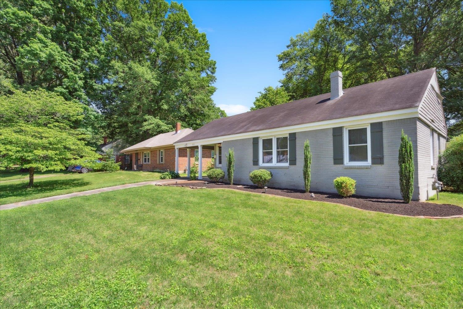5013 New Castle Road Memphis, TN 38117 - Photo 2 of 28 a view of a house with backyard outdoor sitting area and garden