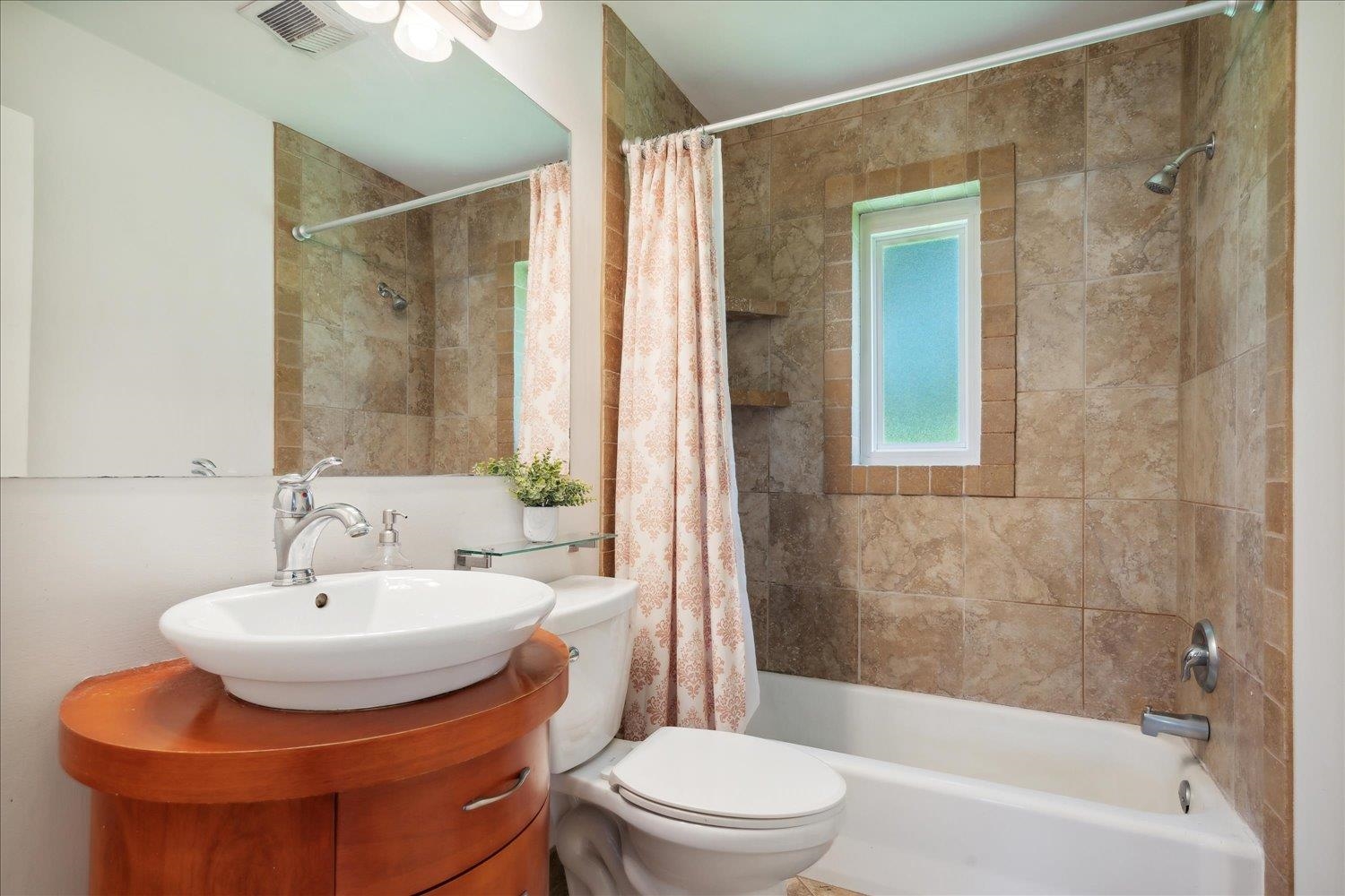 5013 New Castle Road Memphis, TN 38117 - Photo 23 of 28 a bathroom with a sink toilet and shower
