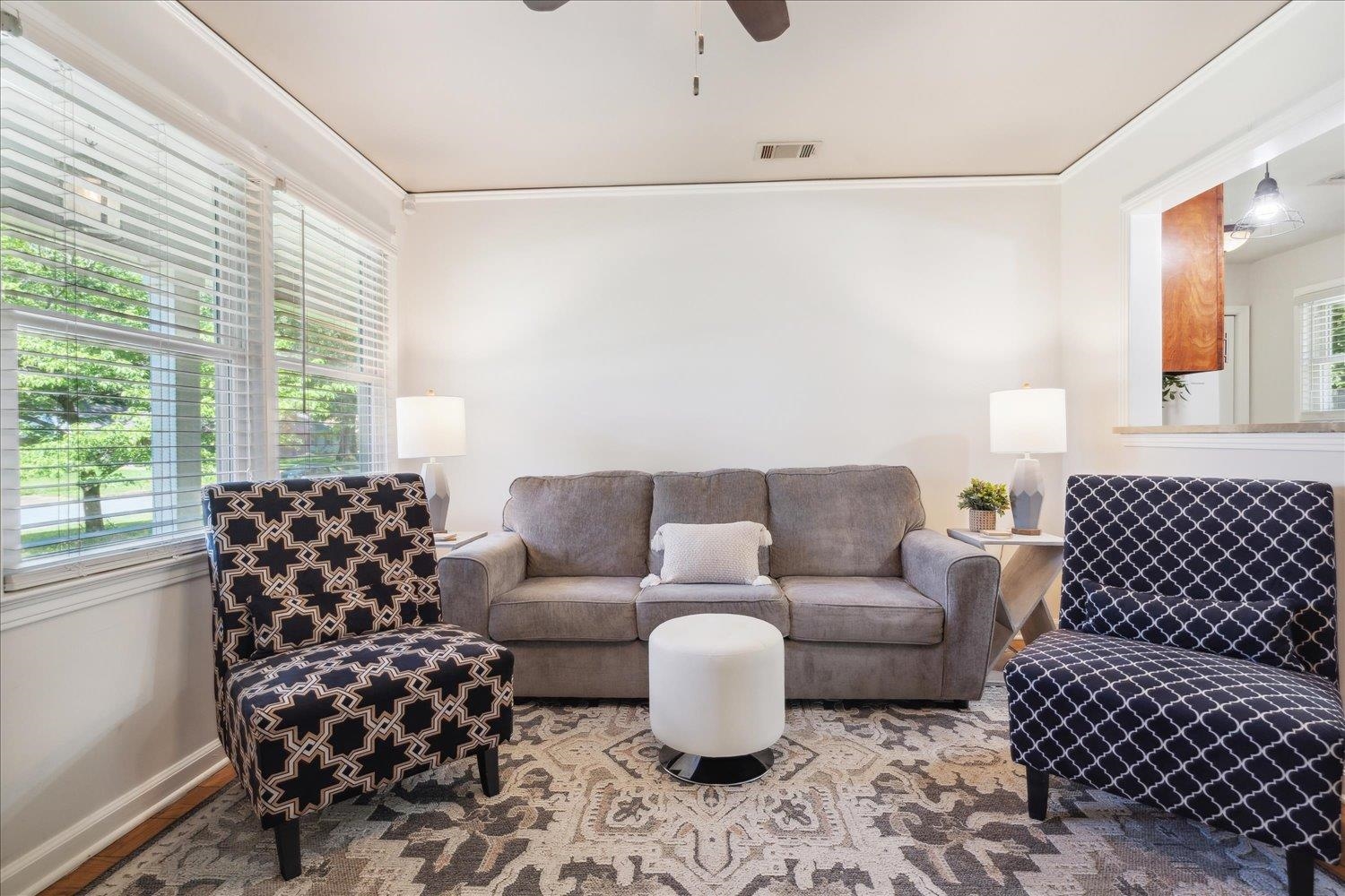 5013 New Castle Road Memphis, TN 38117 - Photo 9 of 28 a living room with furniture and a large window with garden view