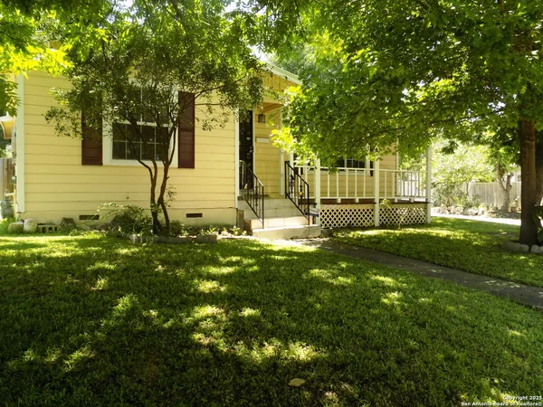 a view of backyard with green space