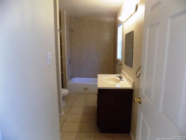 a bathroom with a sink and mirror