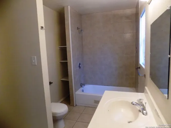 a bathroom with a sink and toilet