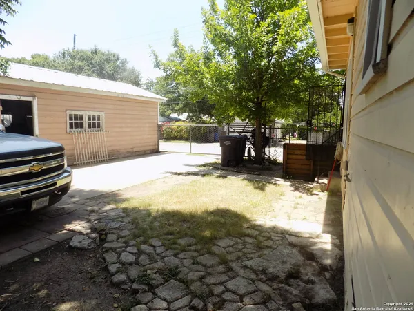 a view of a backyard of the house
