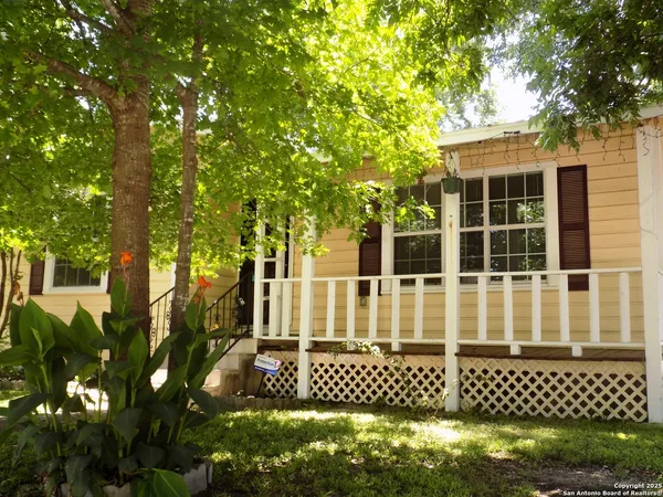 a view of a house with a tree