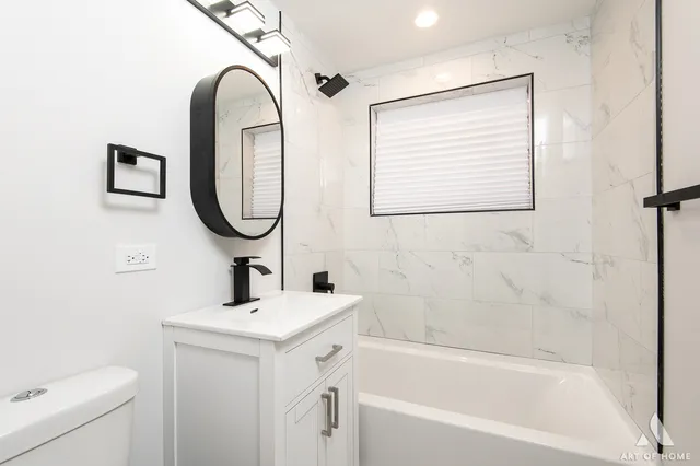 a white refrigerator freezer and a granite counter top