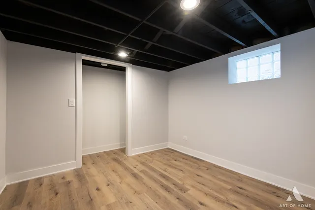 a front view of a house with a yard covered in snow