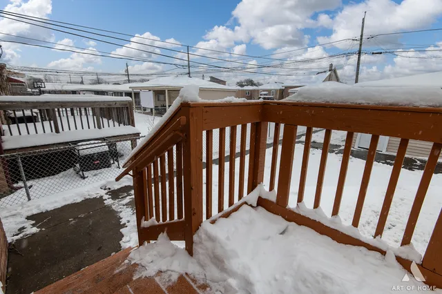 a bedroom with bed and a chandelier