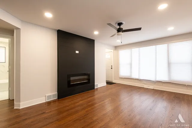 a kitchen with stove cabinets and stainless steel appliances