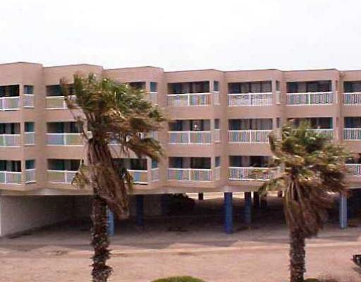 3938 Surfside, Unit 2230 Corpus Christi, TX 78402 - Photo 2 of 3 a view of a building with outdoor space