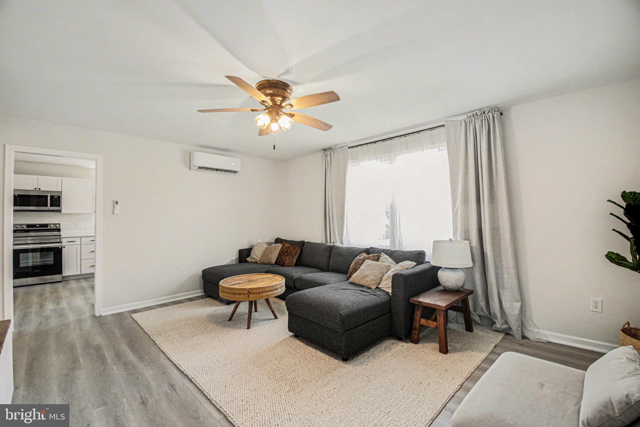 2137 Chapel Way King George, VA 22485 - Photo 16 of 65 a living room with furniture and a chandelier