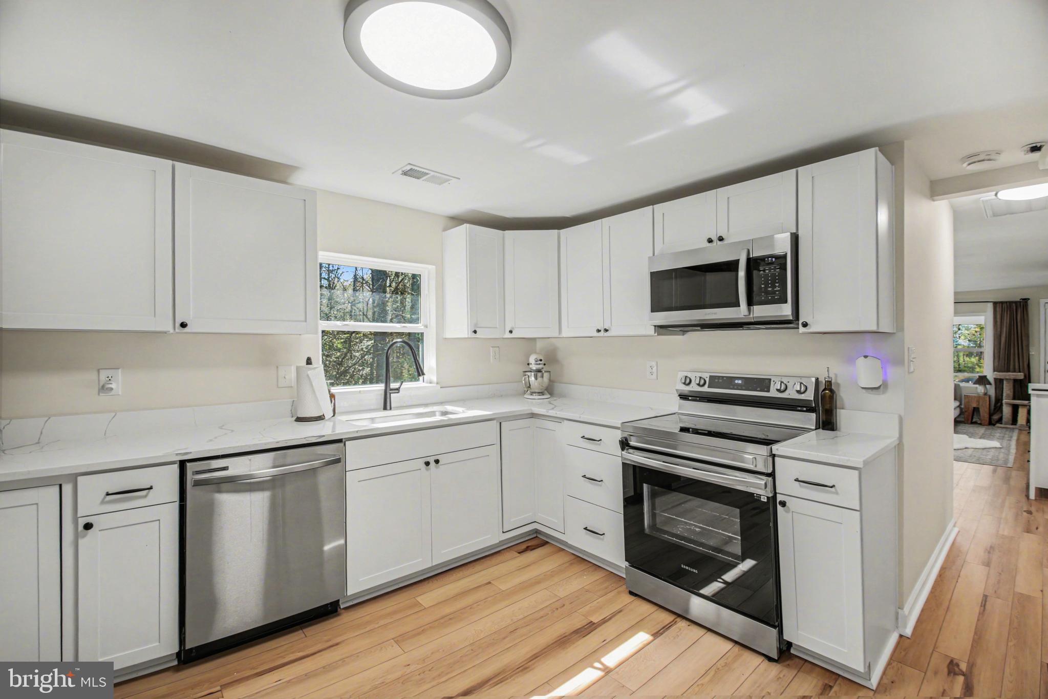 2137 Chapel Way King George, VA 22485 - Photo 19 of 65 a kitchen with a sink stove and microwave