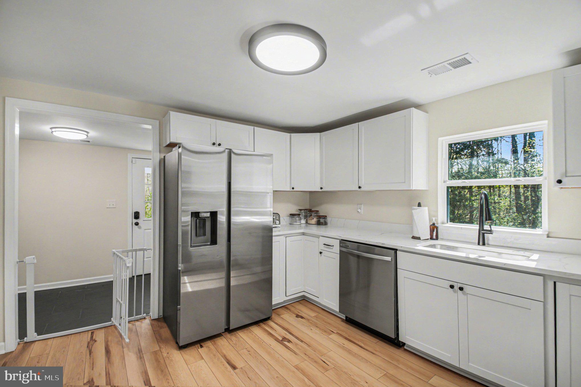 2137 Chapel Way King George, VA 22485 - Photo 20 of 65 a kitchen with a sink cabinets stainless steel appliances and a window