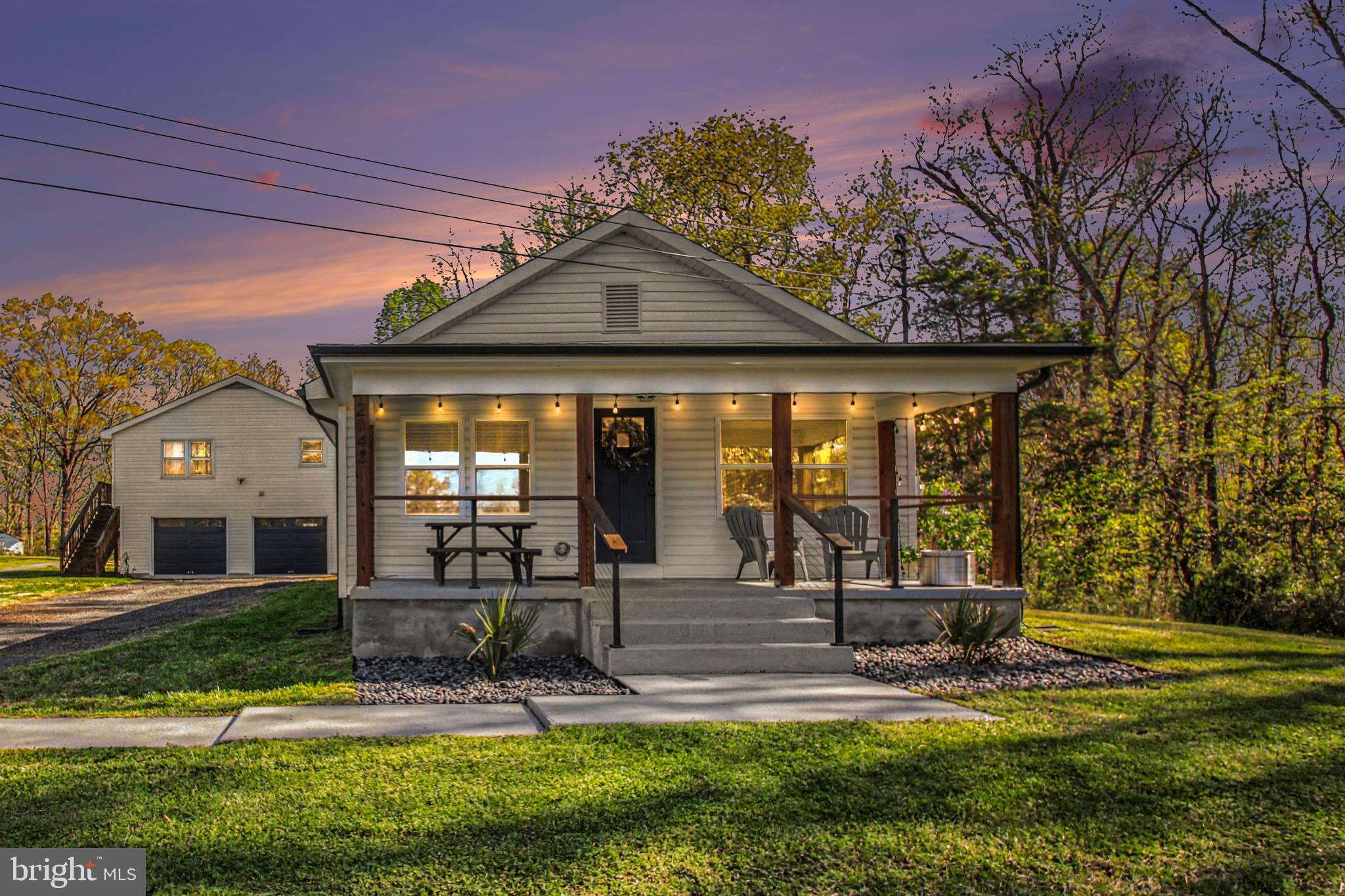 2137 Chapel Way King George, VA 22485 - Photo 2 of 65 a view of a house with big yard and large trees