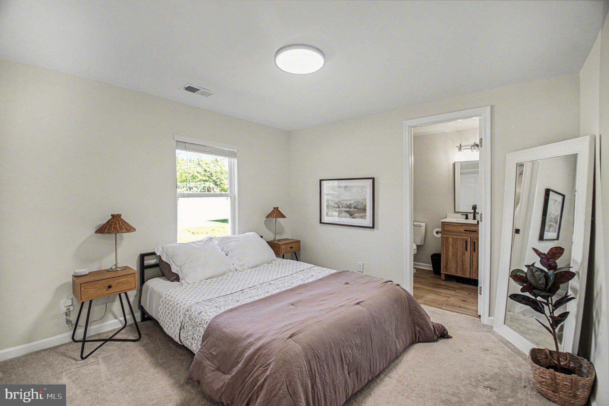 2137 Chapel Way King George, VA 22485 - Photo 22 of 65 a bedroom with a bed and a flat tv screen on the dresser