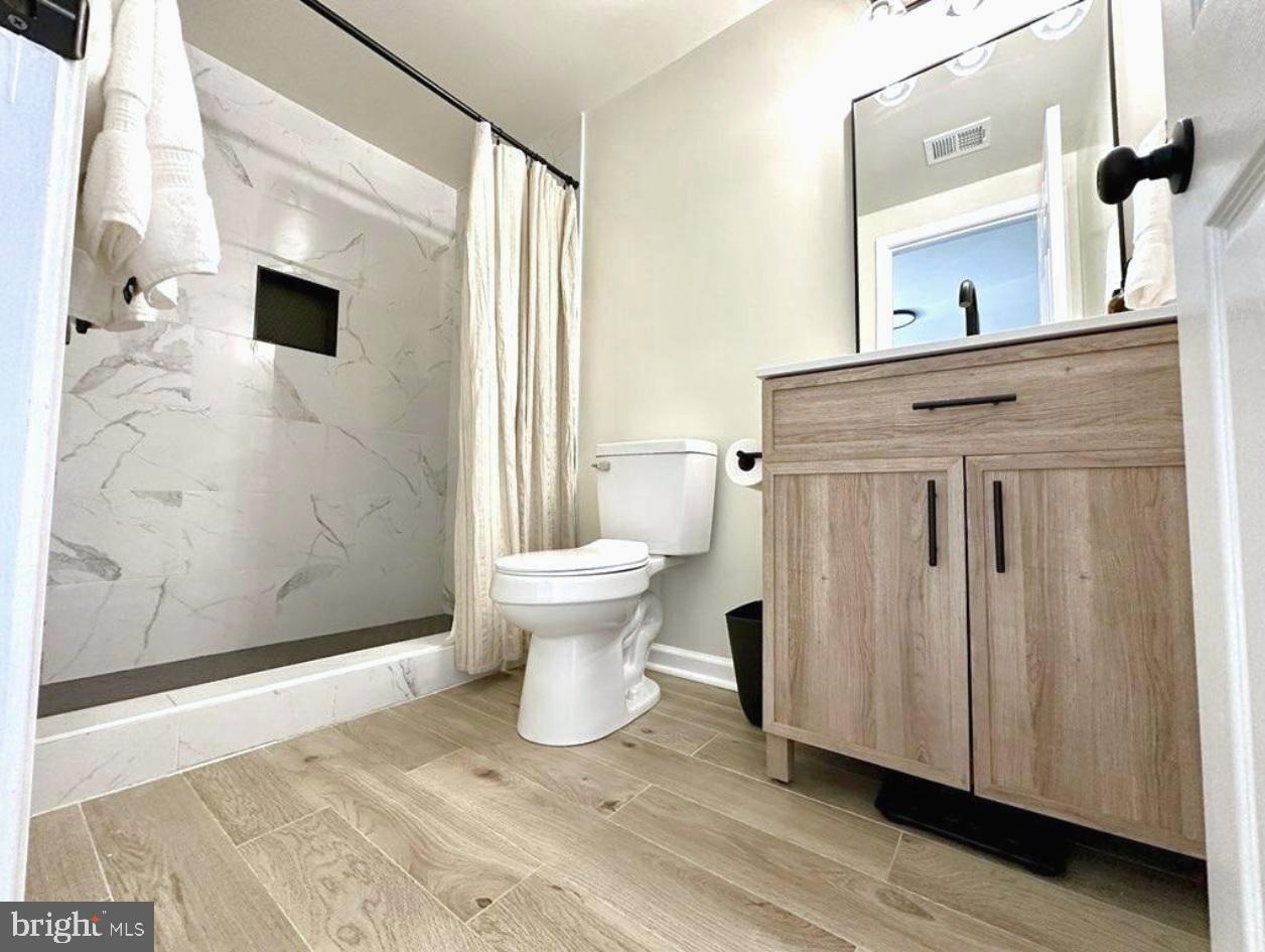 2137 Chapel Way King George, VA 22485 - Photo 28 of 65 a view of a bathroom with a sink and mirror