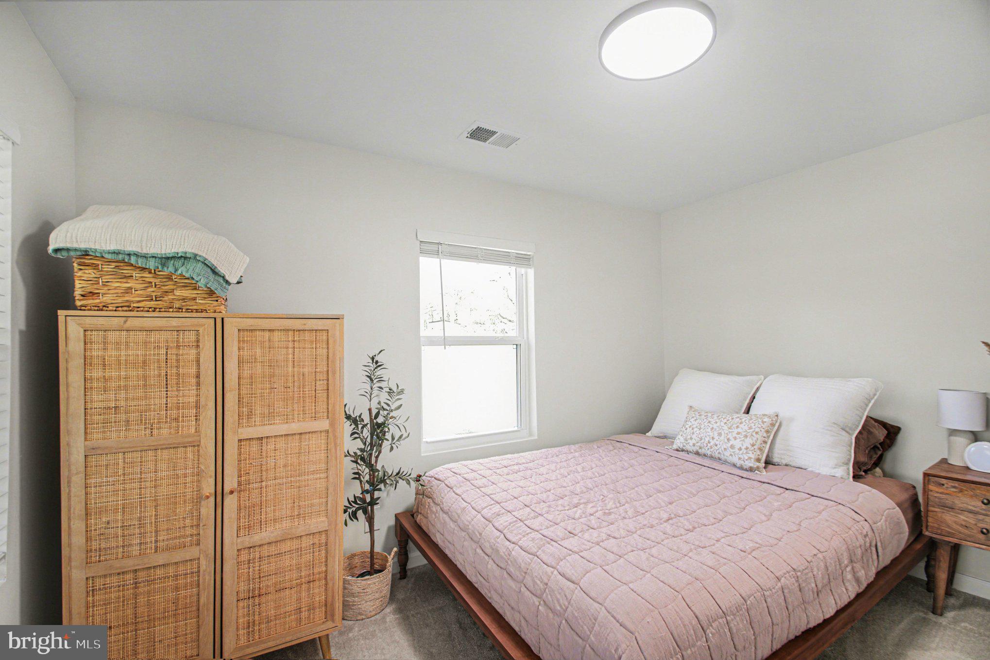 2137 Chapel Way King George, VA 22485 - Photo 36 of 65 a bedroom with a bed and a window