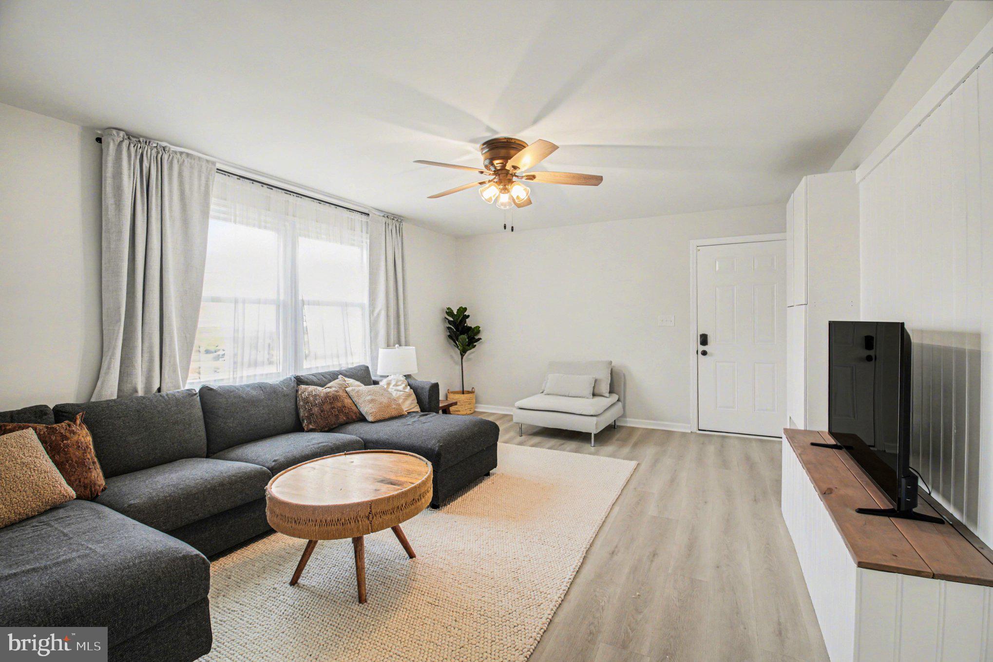 2137 Chapel Way King George, VA 22485 - Photo 42 of 65 a living room with furniture a ceiling fan and a window
