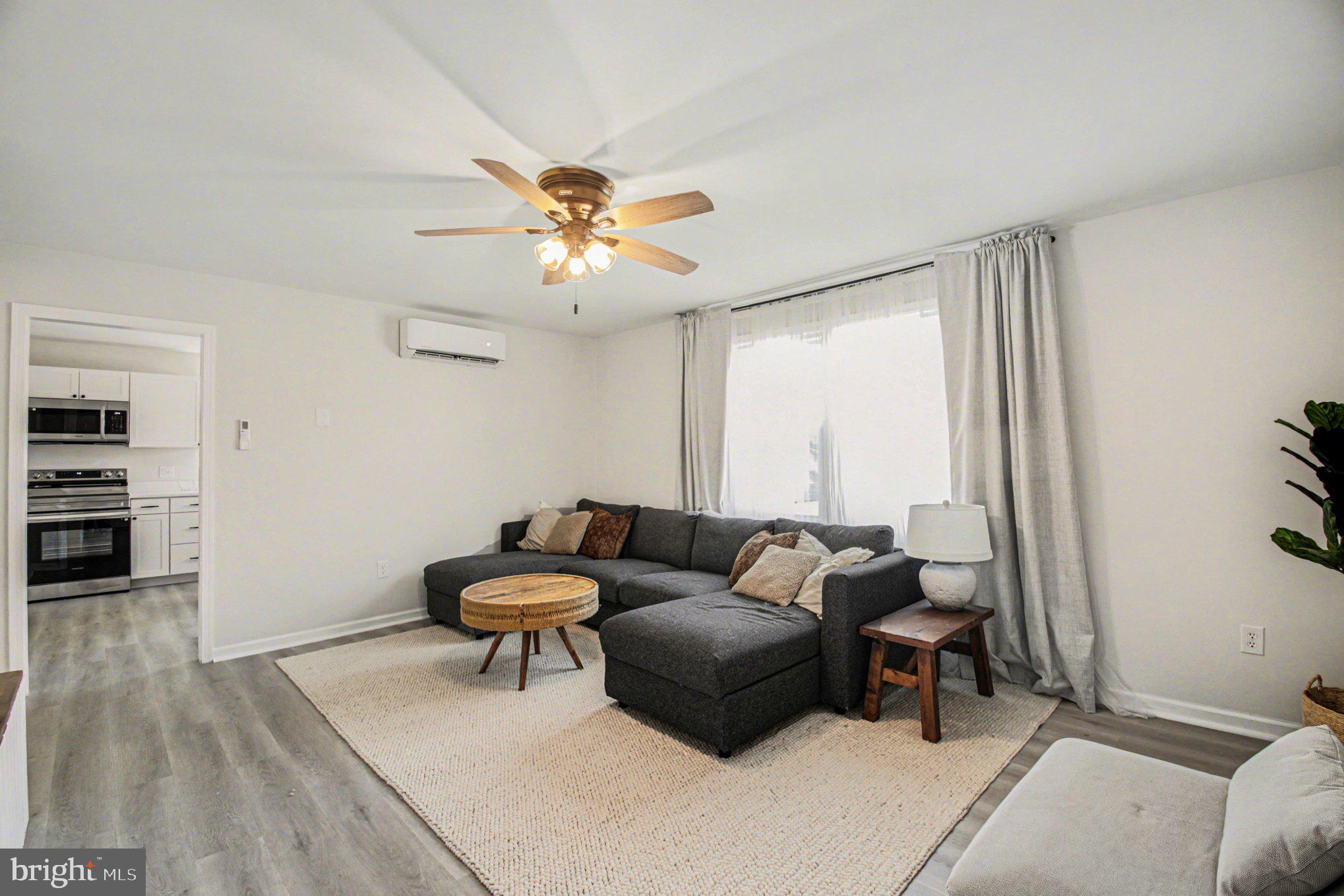 2137 Chapel Way King George, VA 22485 - Photo 44 of 65 a living room with furniture and a large window