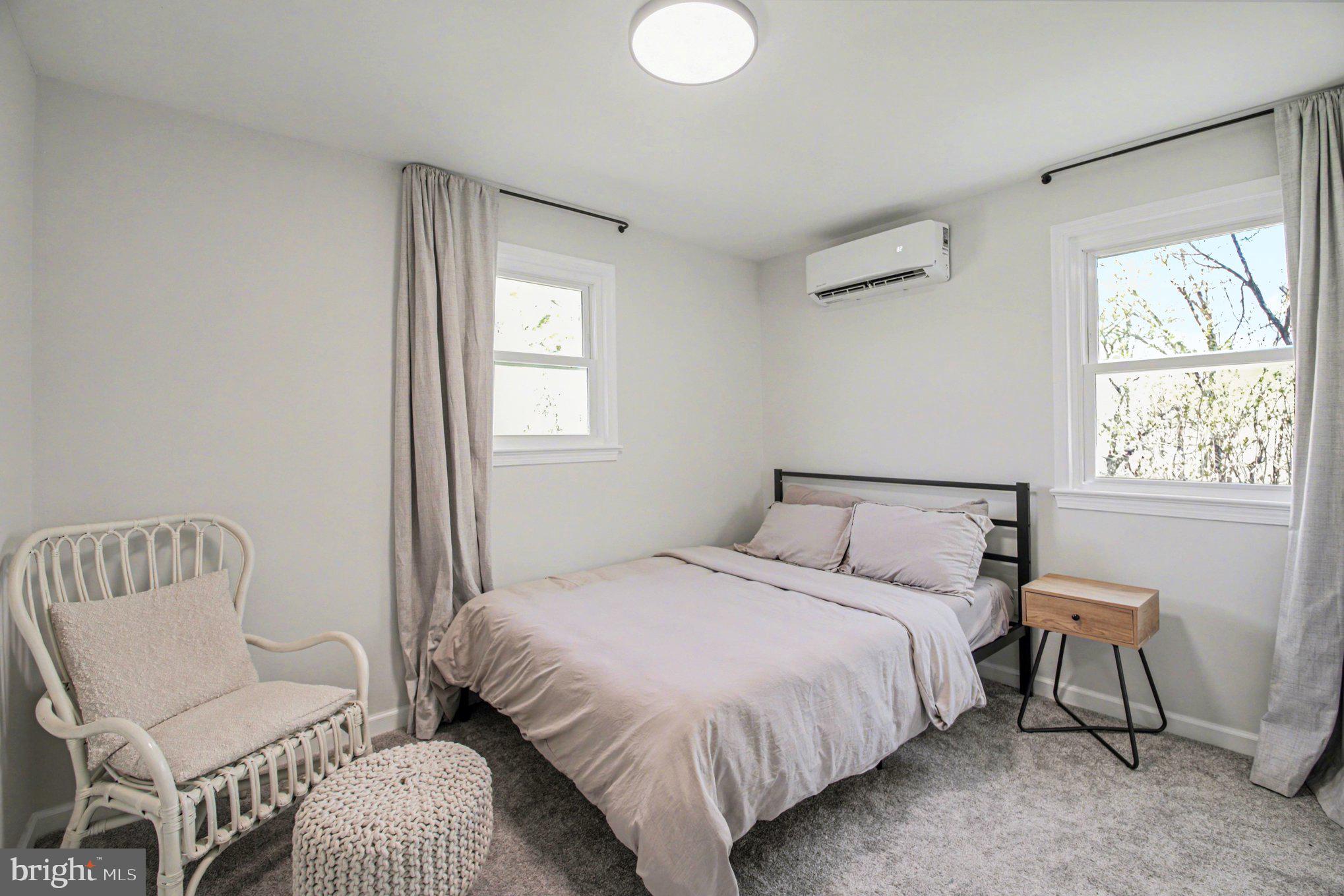 2137 Chapel Way King George, VA 22485 - Photo 53 of 65 a bedroom with a bed and a chair