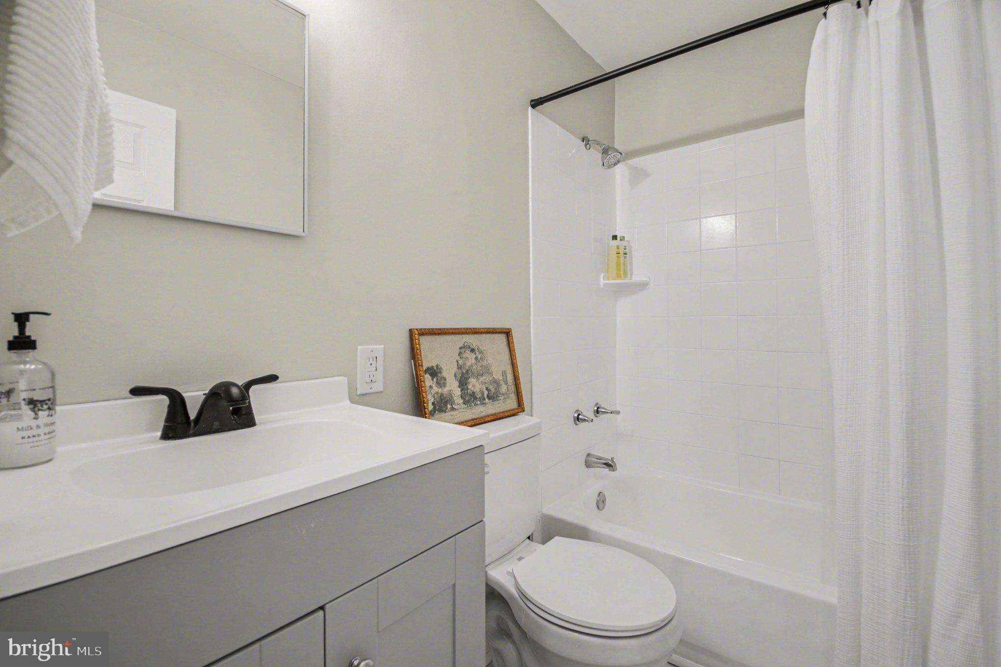 2137 Chapel Way King George, VA 22485 - Photo 55 of 65 a bathroom with a sink a toilet and shower