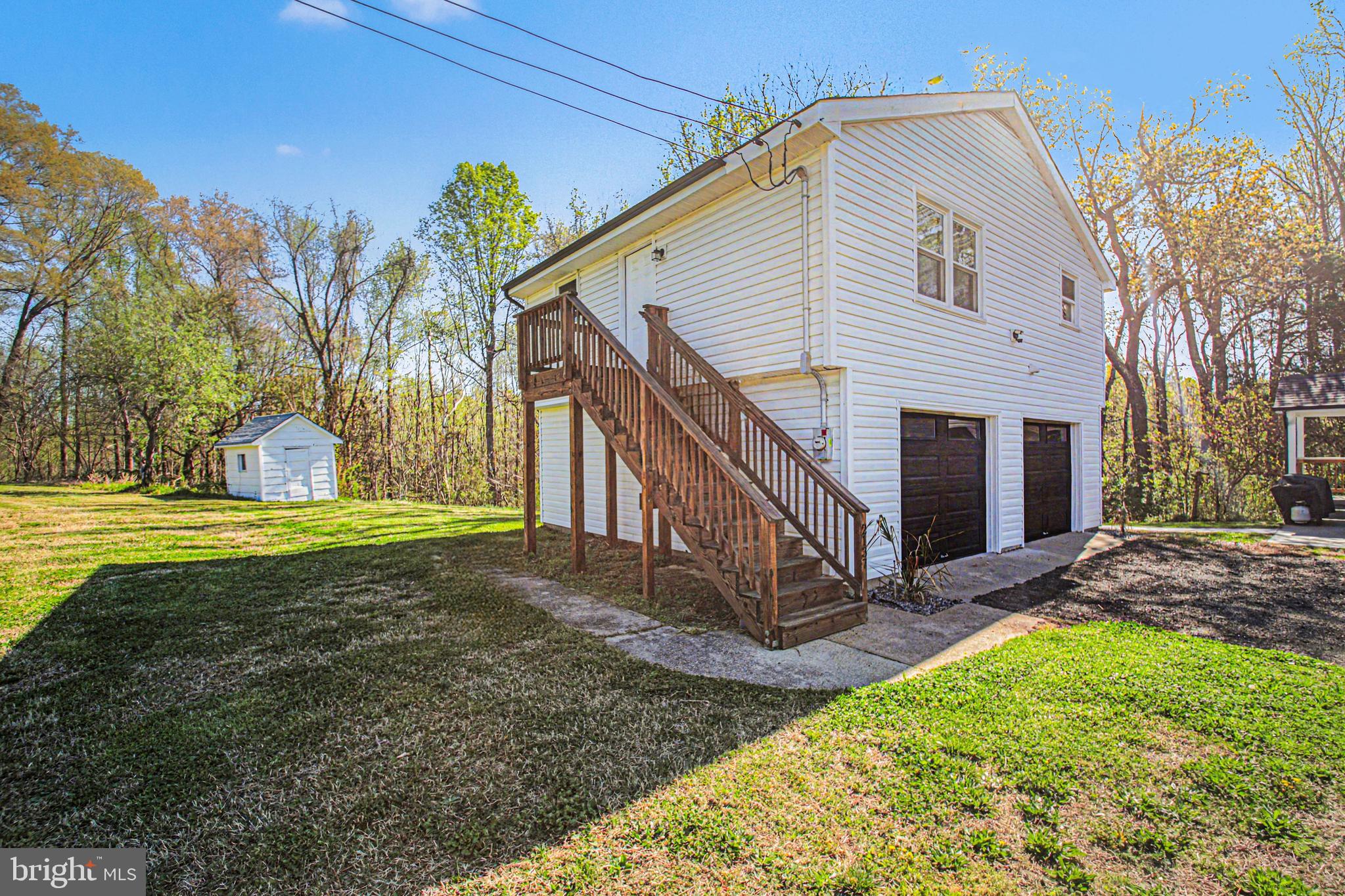 2137 Chapel Way King George, VA 22485 - Photo 57 of 65 a view of a house with backyard and a tree