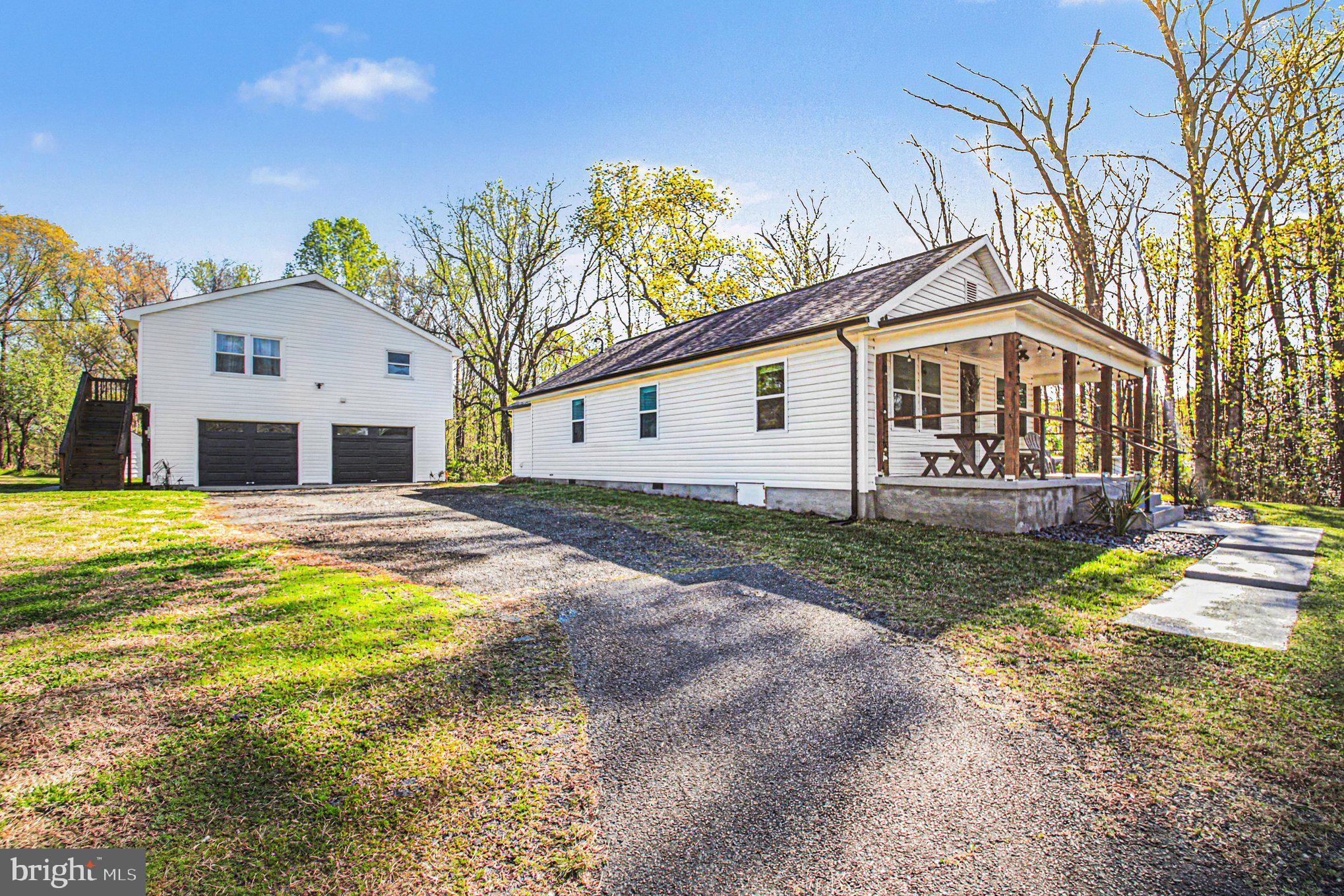 2137 Chapel Way King George, VA 22485 - Photo 58 of 65 a front view of a house with a yard and porch