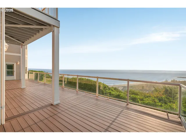 a view of outdoor space with wooden floor and city view