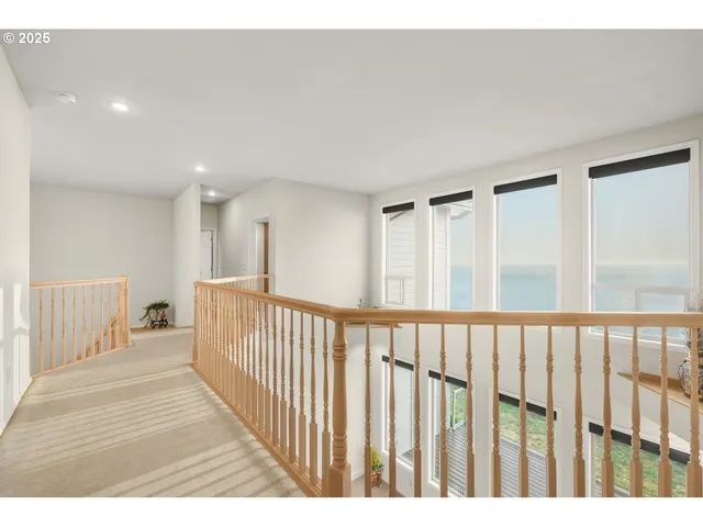 a view of a bedroom with wooden floor