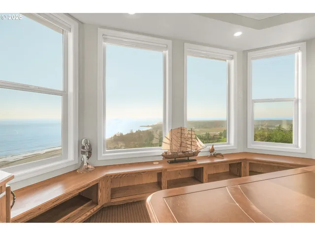 a view of open kitchen with granite countertop a sink and a window