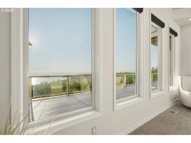 a view of a room that has a large window