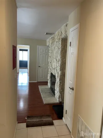 a view of a hallway view with wooden floor and staircase