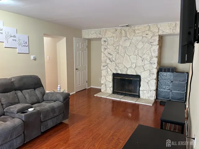a living room with furniture and a fireplace