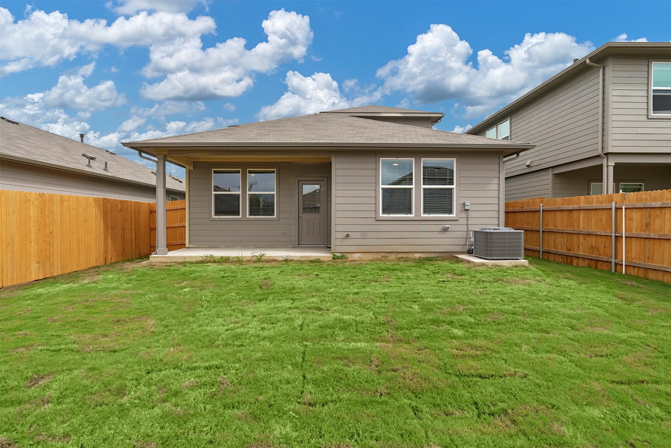 2909 Tweedy Trail Pflugerville, TX 78660 - Photo 25 of 27 A spacious yard perfect for outdoor activities with a covered patio for relaxation.