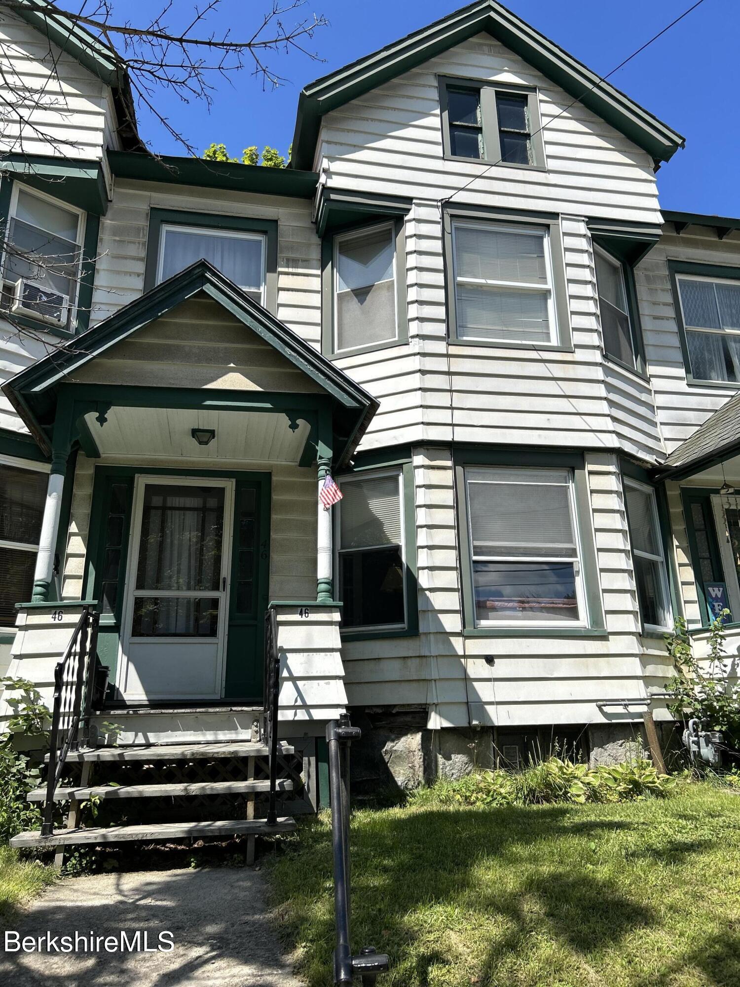 a front view of a house with a balcony