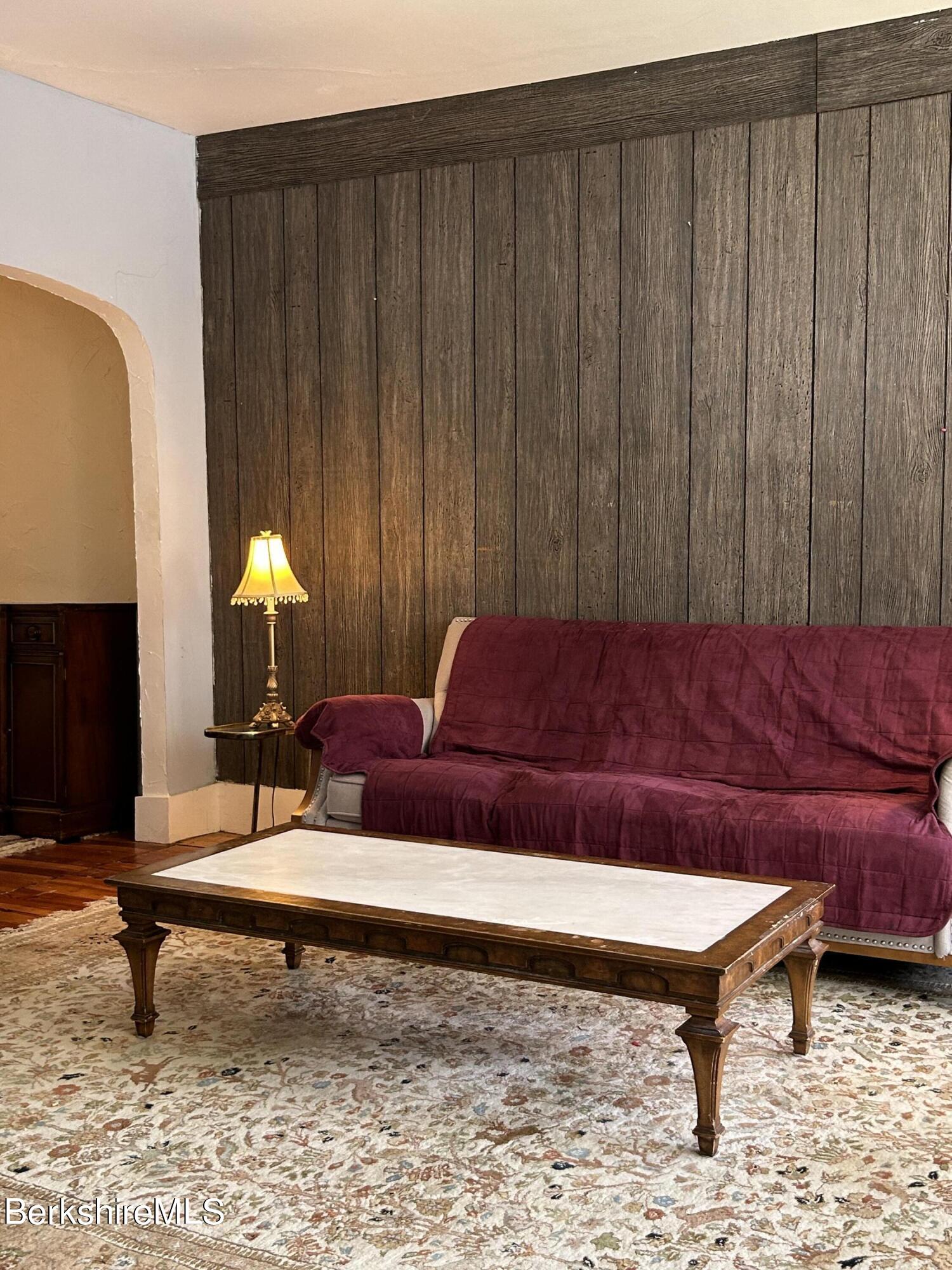 46 Summer Street Adams, MA 01220 - Photo 11 of 35 a living room with furniture and a fireplace