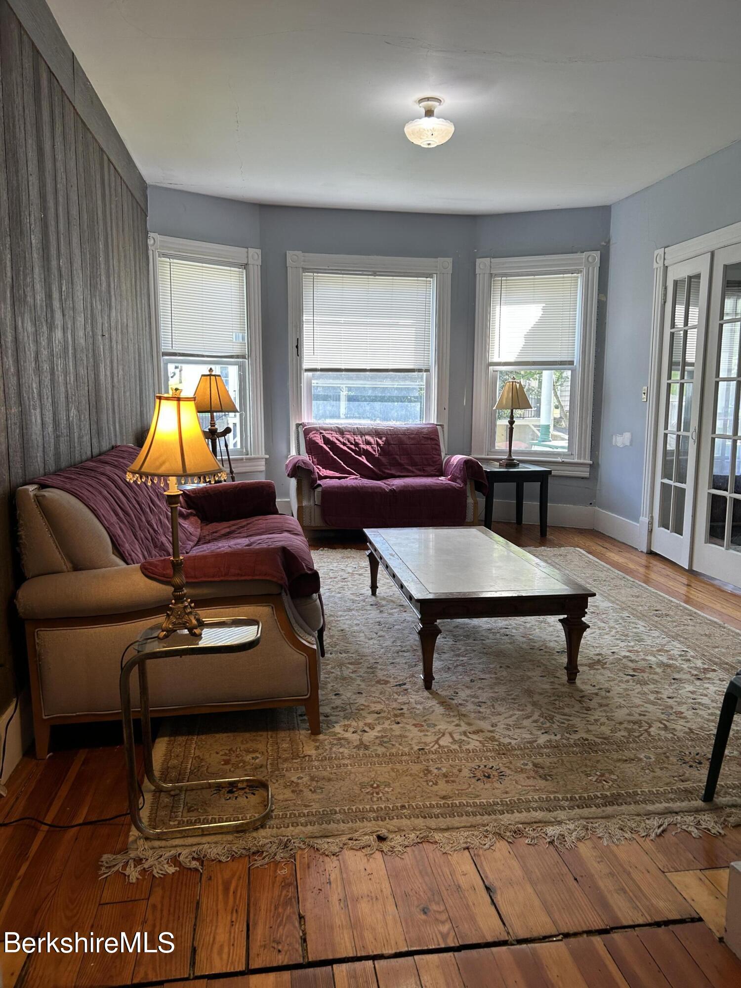 46 Summer Street Adams, MA 01220 - Photo 12 of 35 a living room with furniture a lamp and a window