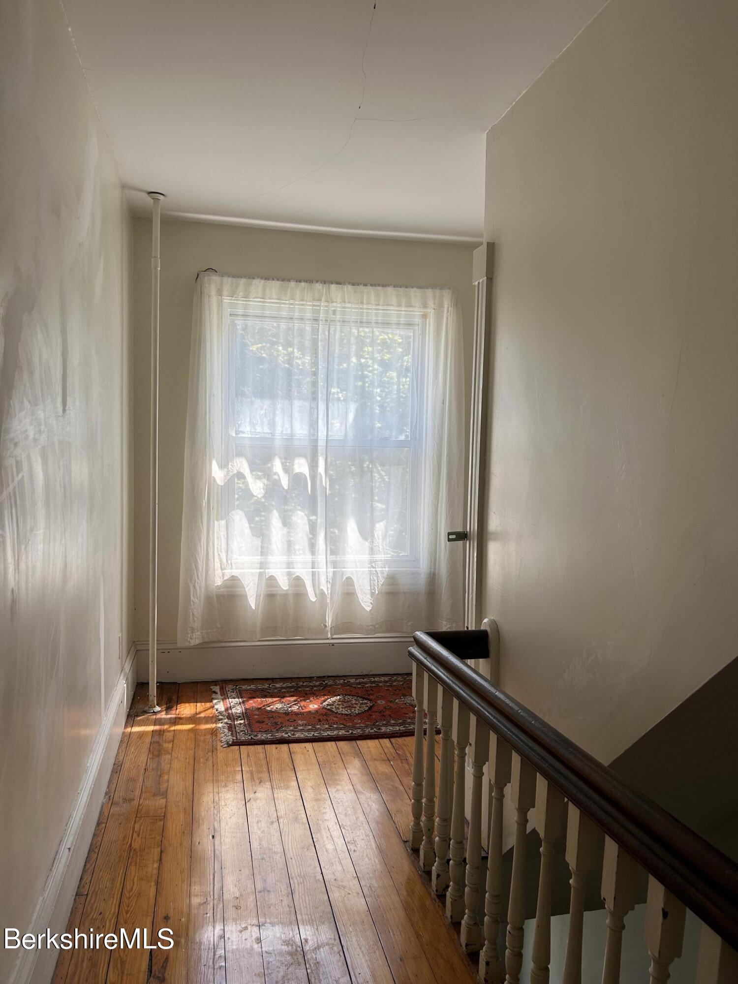 46 Summer Street Adams, MA 01220 - Photo 21 of 35 a view of a room with wooden floor and a window
