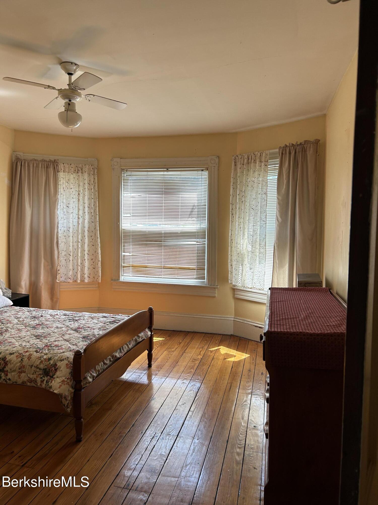 46 Summer Street Adams, MA 01220 - Photo 23 of 35 a bedroom with a bed and a dresser