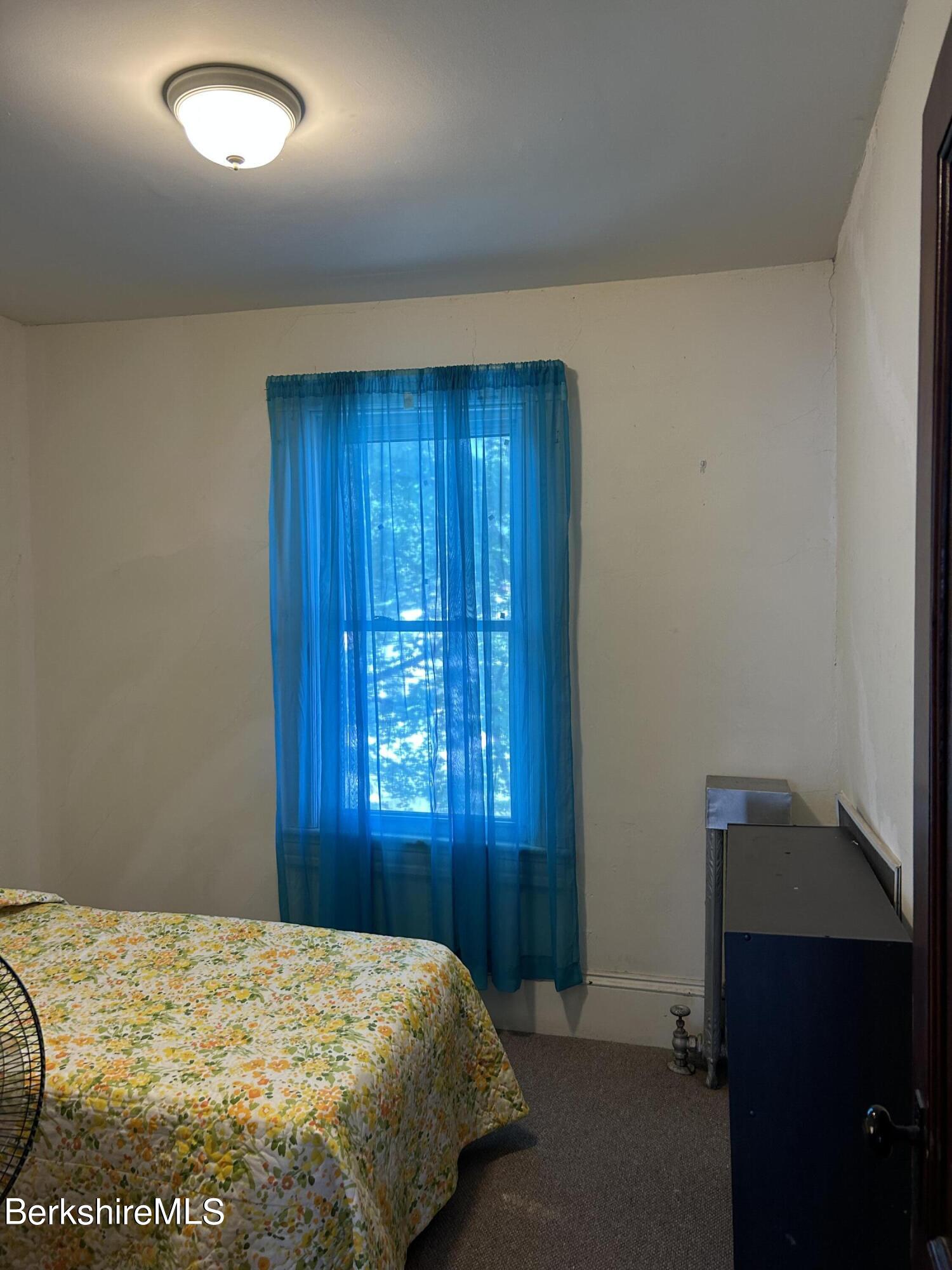 46 Summer Street Adams, MA 01220 - Photo 27 of 35 a bedroom with a bed and a window