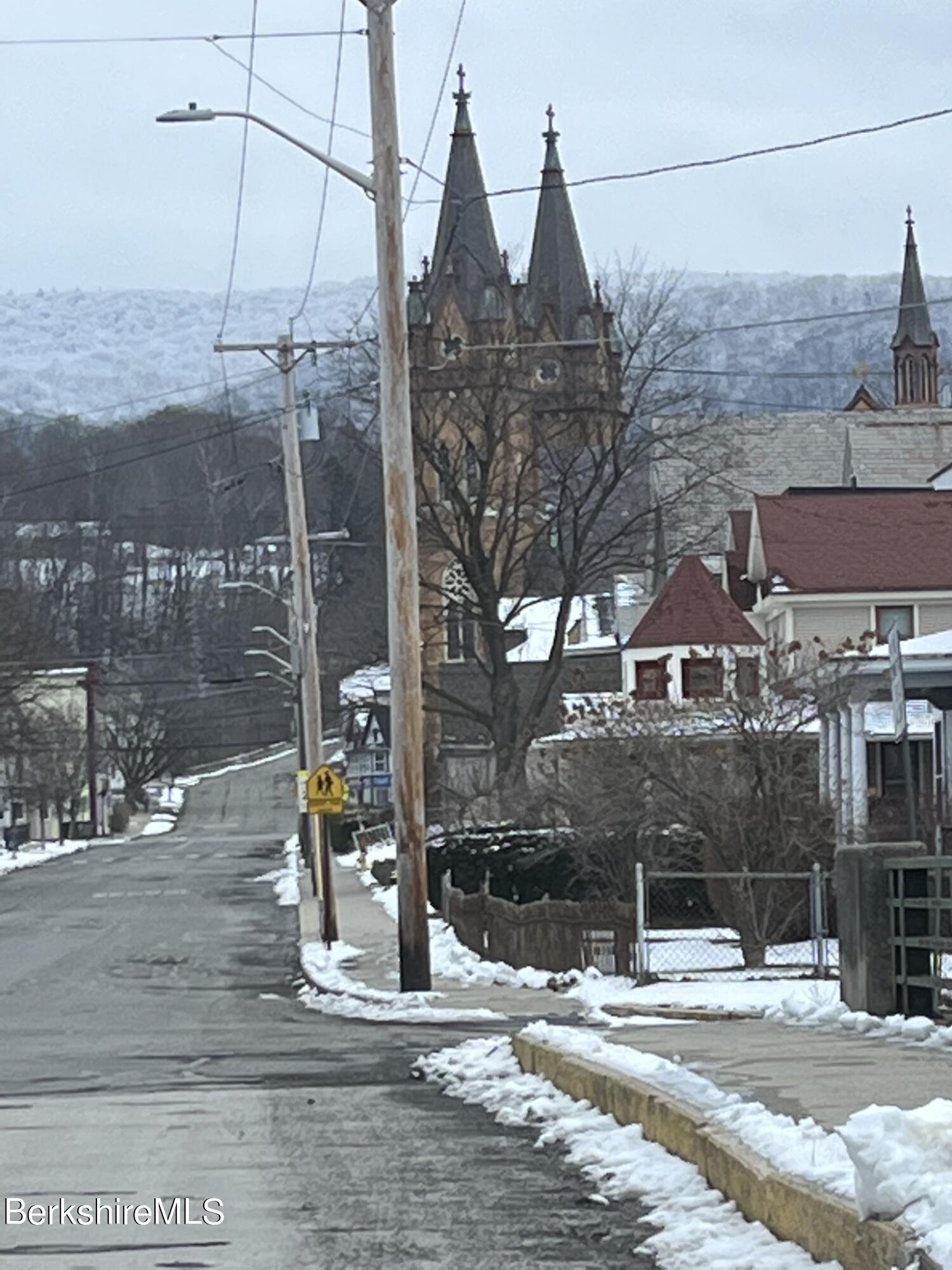 46 Summer Street Adams, MA 01220 - Photo 3 of 35 a view of a building with traffic signal