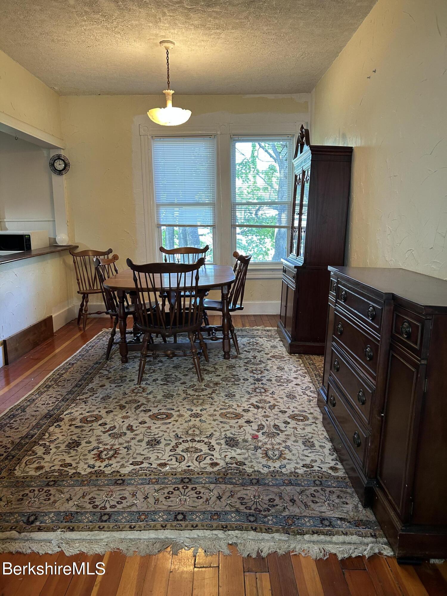 46 Summer Street Adams, MA 01220 - Photo 9 of 35 a view of a dining room with furniture window and wooden floor