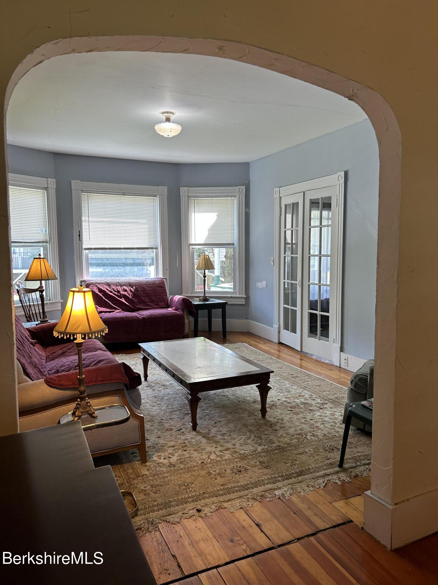 46 Summer Street Adams, MA 01220 - Photo 10 of 35 a living room with furniture a rug and a window