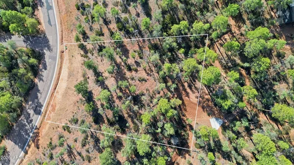 a view of a lush green hillside and houses