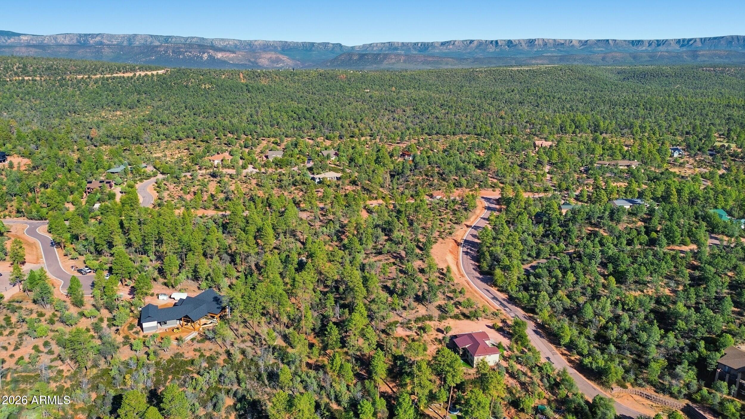 1302 North Karen Way, Unit 11 Payson, AZ 85541 - Photo 8 of 9 a view of a lush green hillside and houses