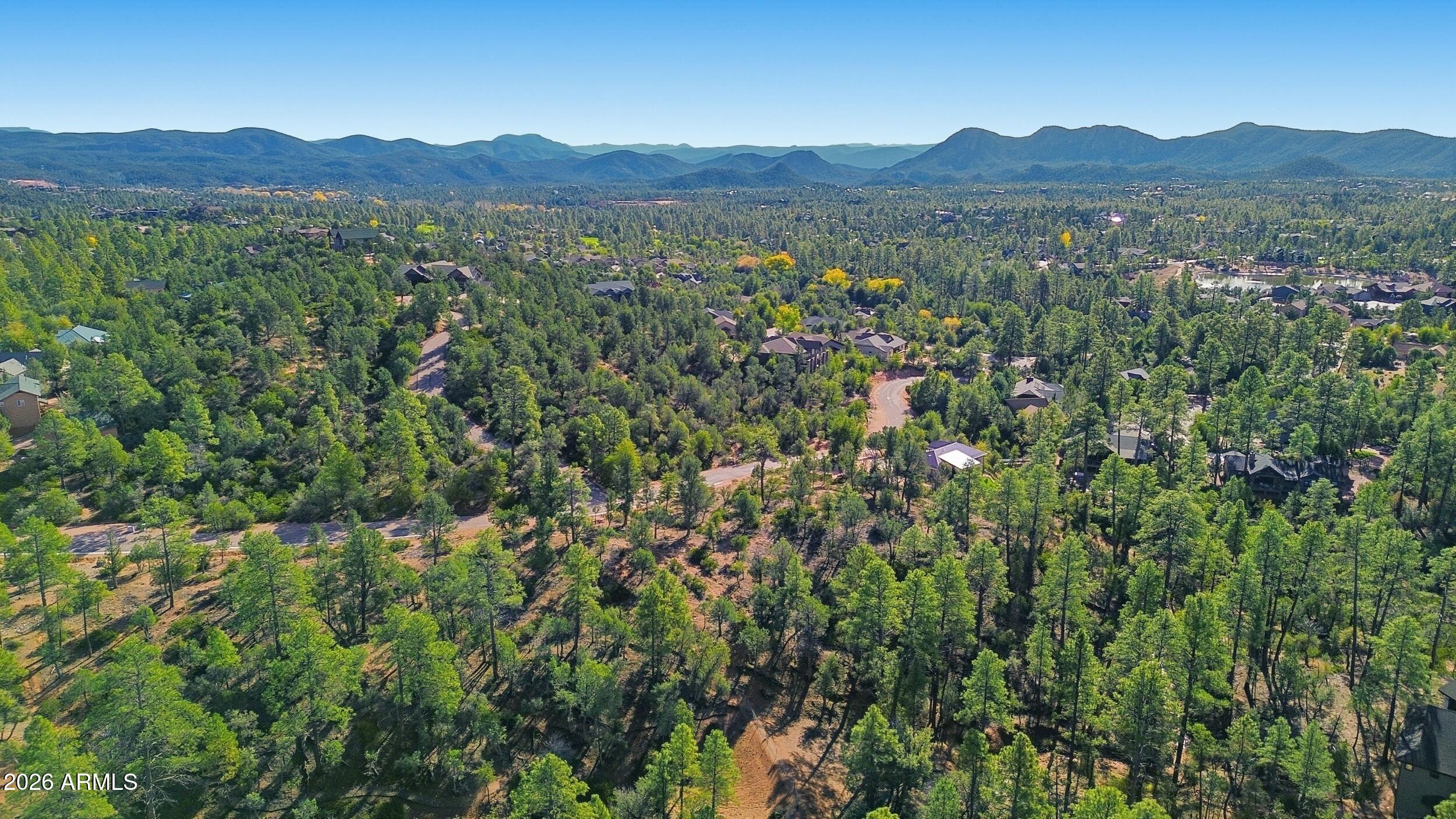 1302 North Karen Way, Unit 11 Payson, AZ 85541 - Photo 9 of 9 a view of a lush green hillside and a houses